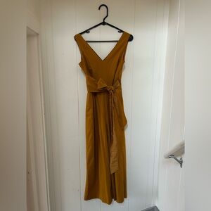 Mustard wide leg jumpsuit with wrap back and tie at the waist